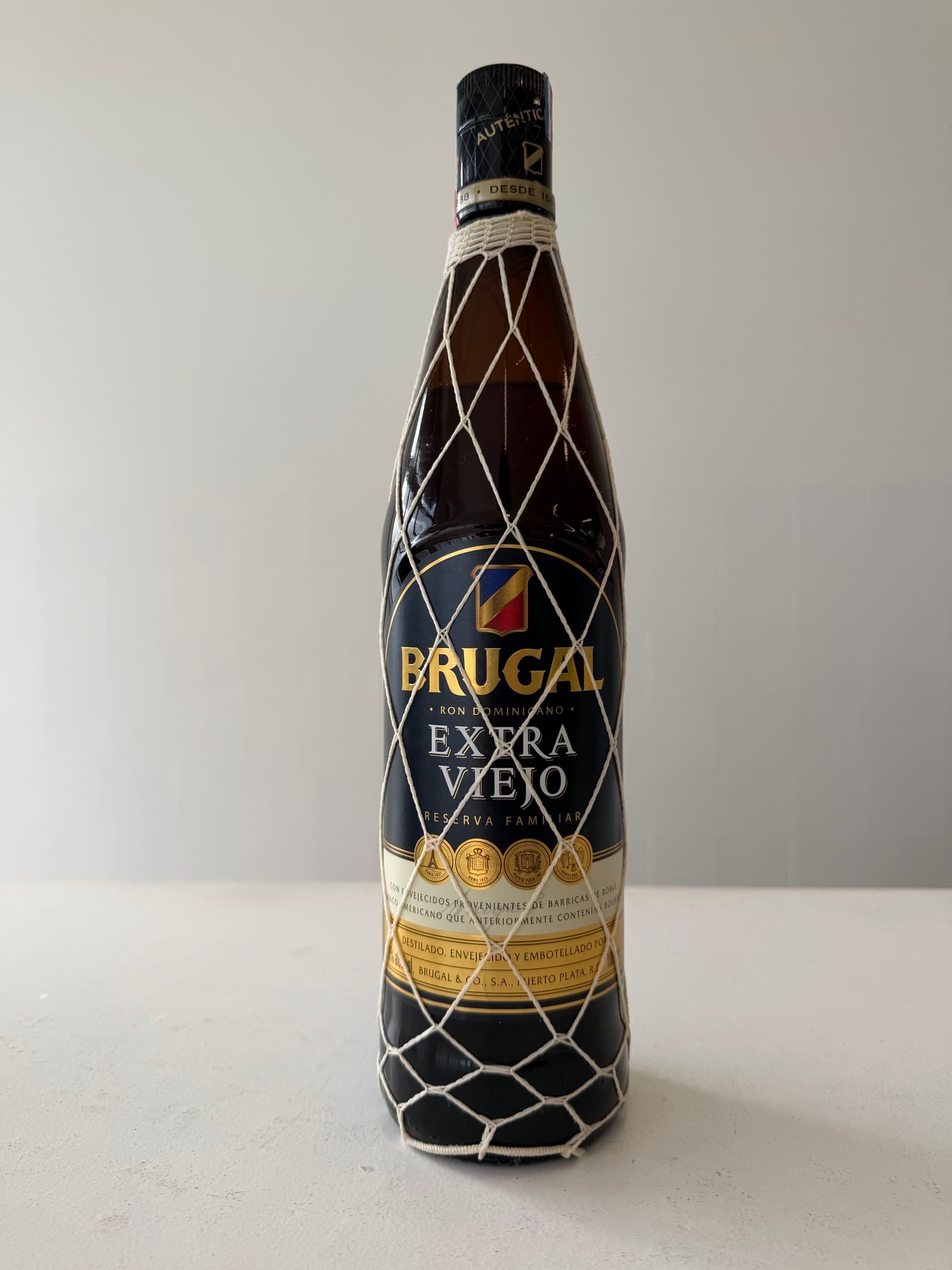 Brugal Extra Viejo Reserva Familiar – Dominican Aged Rum – Traditional Netted Bottle